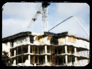 Construction site - pumping concrete with crane